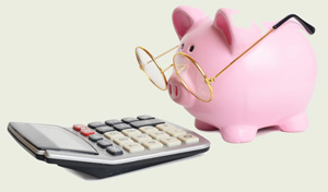 Piggybank and calculator. Isolated on white background